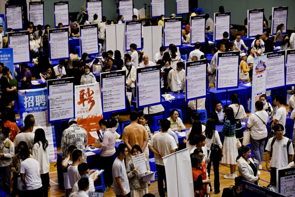 his photo taken on June 2, 2024 shows people attending a job fair in Huai'an, in eastern China's Jiangsu province.