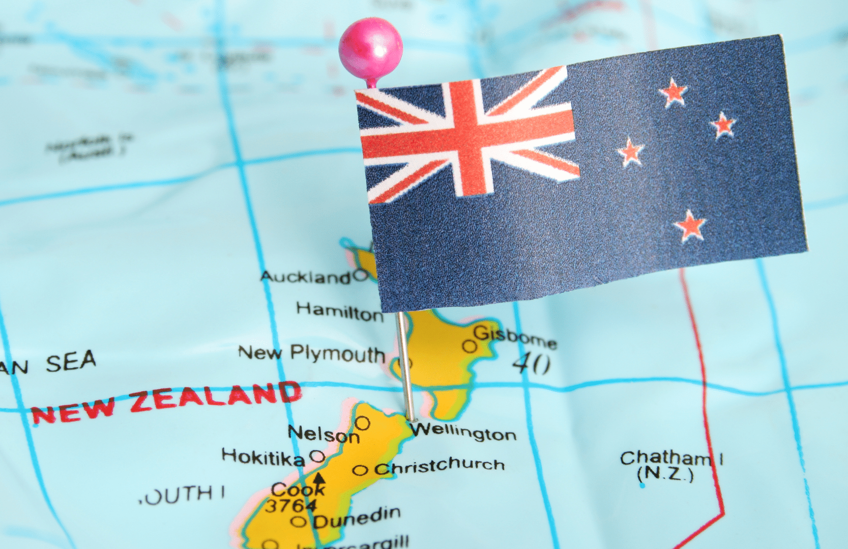 New Zealand cuts rates for first time in four years