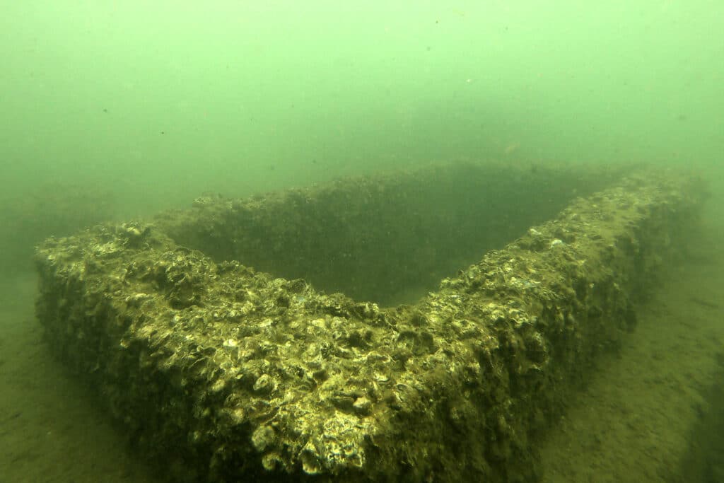  This picture taken on December 13, 2022 shows a submerged tomb in a village graveyard, now underwater due to the effects of climate change, in the coastal town of Togoru, some 35 kilometres from Fijis capital city Suva.