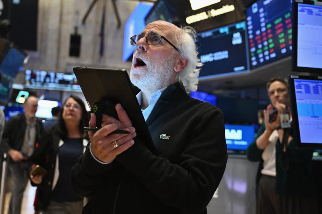 Traders work on the floor of the New York Stock Exchange (NYSE) during morning trading in New York on August 23, 2024