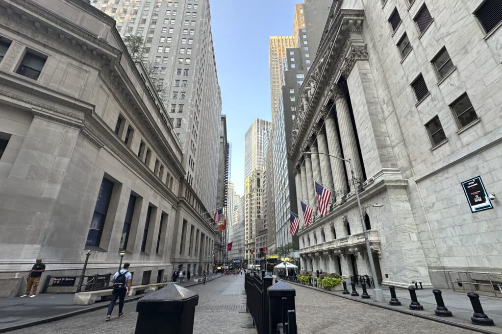 The New York Stock Exchange, at right, is shown on Wednesday, Aug. 14, 2024, in New York. 