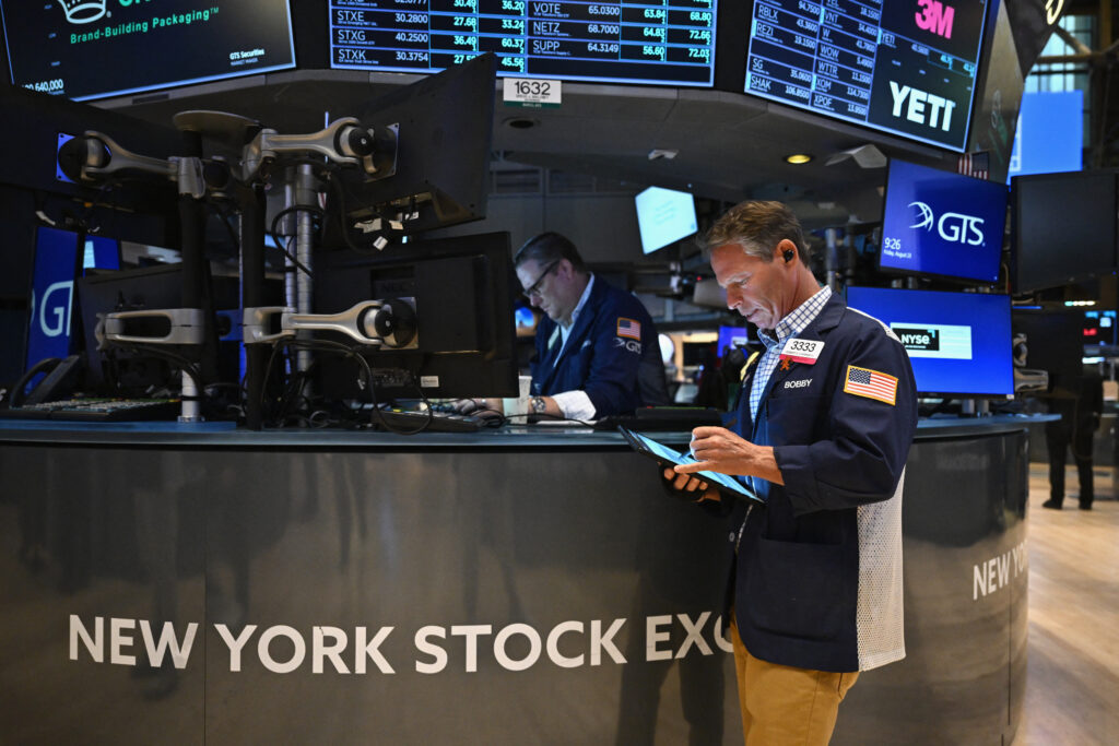 Traders work on the floor of the New York Stock Exchange (NYSE) during morning trading in New York on August 23, 2024.