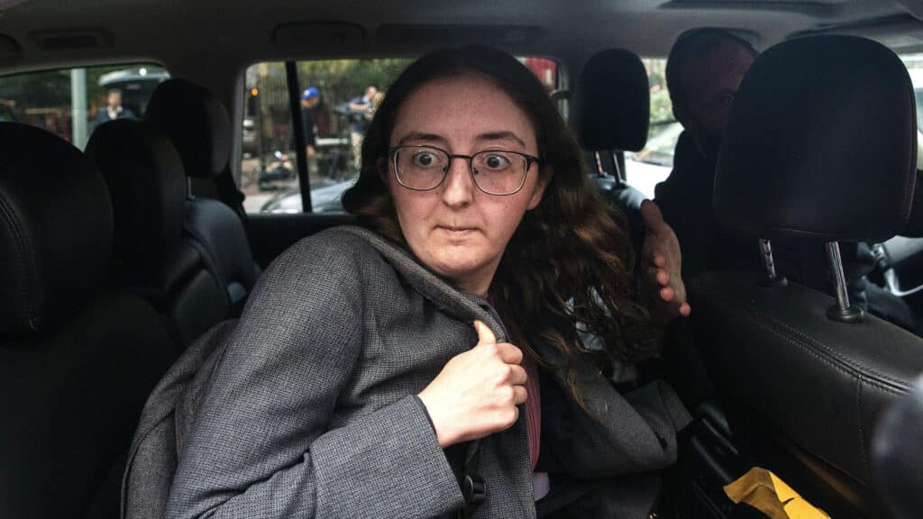 Caroline Ellison, former CEO of Alameda Research founded by Sam Bankman-Fried, goes into a wrong car as she exits the Manhattan federal court after testifying on Tuesday, Oct. 10, 2023, in New York. (AP Photo/Eduardo Munoz Alvarez, File)