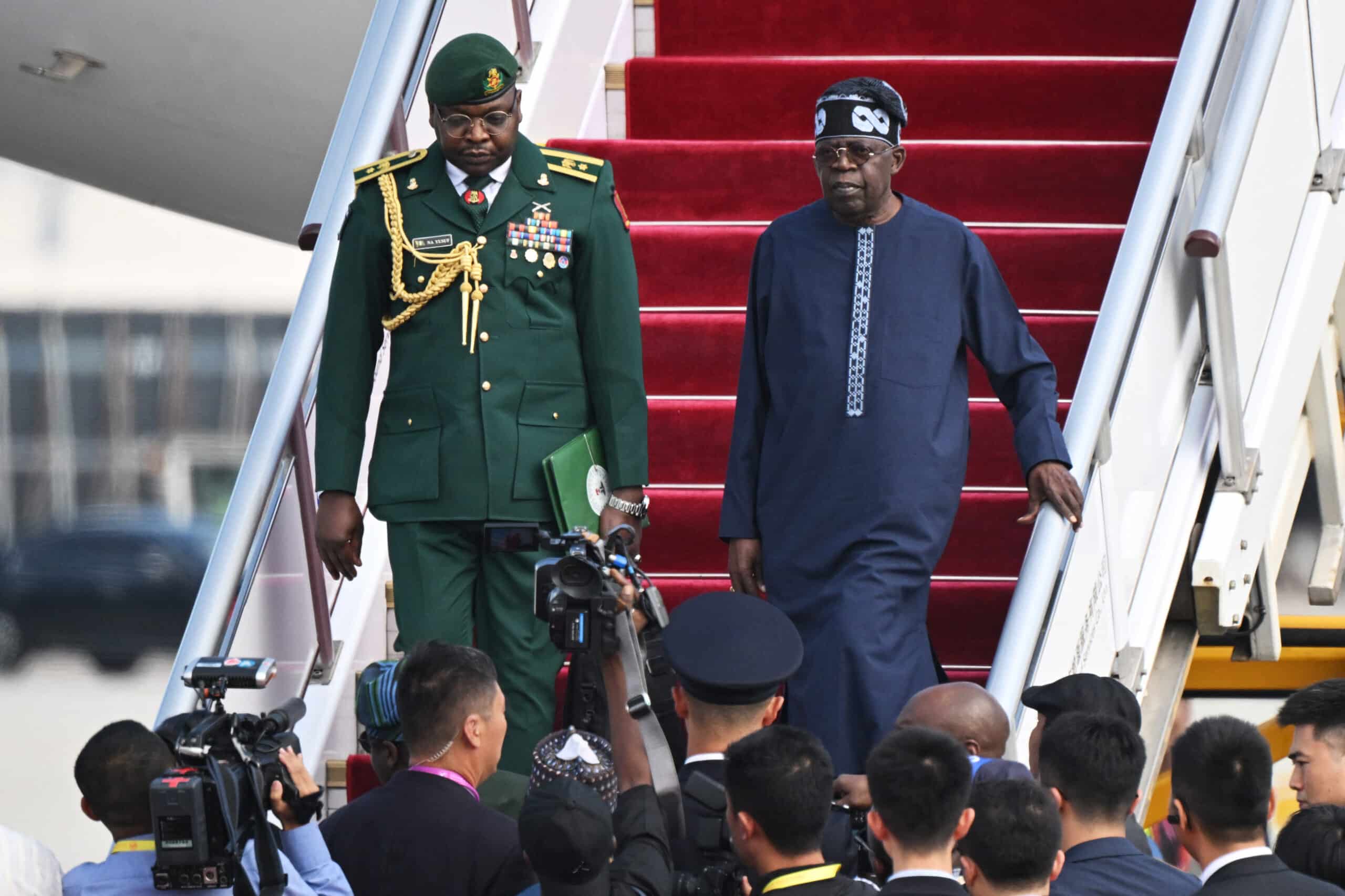 Nigeria’s President Bola Ahmed Tinubu (R) arrives at Beijing Capital Airport ahead of the Forum on China-Africa Cooperation (FOCAC), on September 1, 2024. 