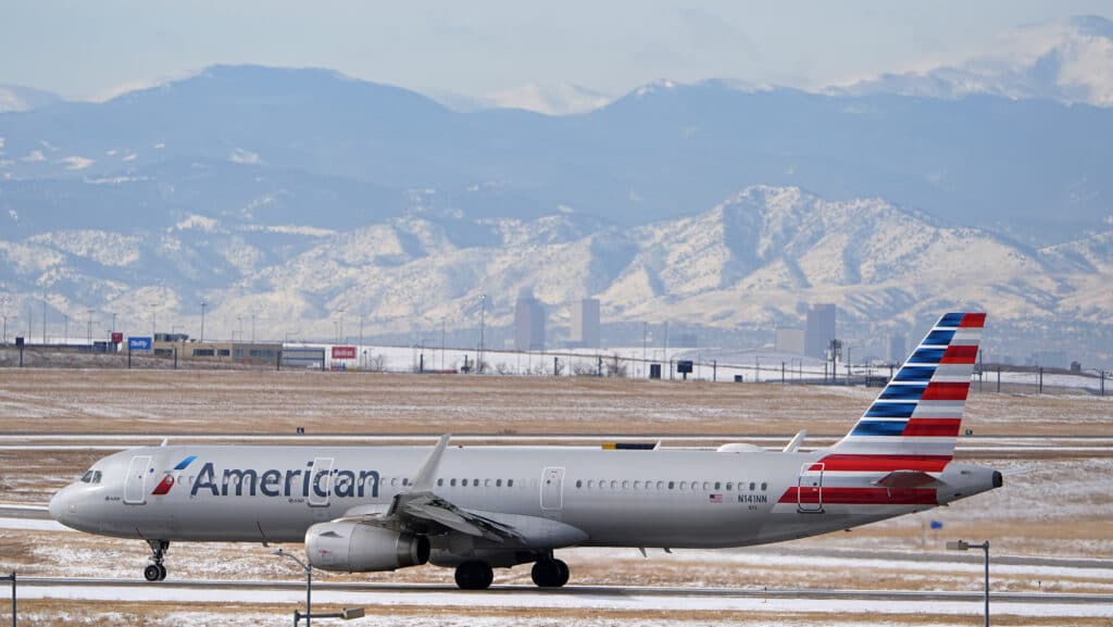 An American Airlines jetliner rumbles down a runway at Denver International Airport, Jan. 16, 2024, in Denver.