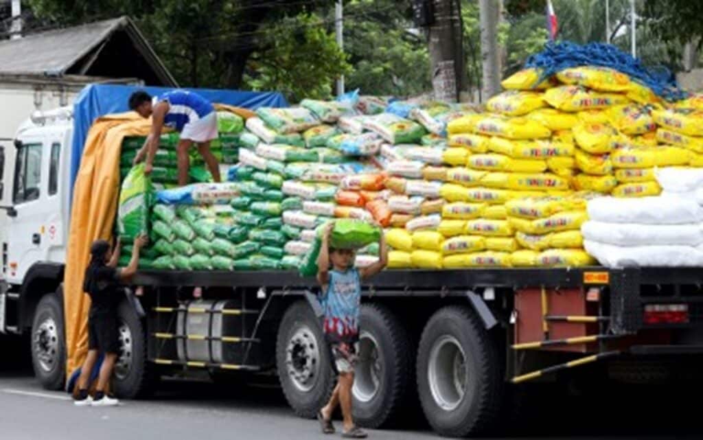 STABLE SUPPLY. Workers move sacks of rice to another truck along Dagupan Street in Tondo, Manila on Sept. 9, 2024. Agriculture Assistant Secretary Arnel De Mesa said Wednesday (Oct. 2, 2024) rice imports may surpass last year’s volume to supplement the country’s strong harvest and maintain a stable rice supply in the country. (PNA photo by Yancy Lim)