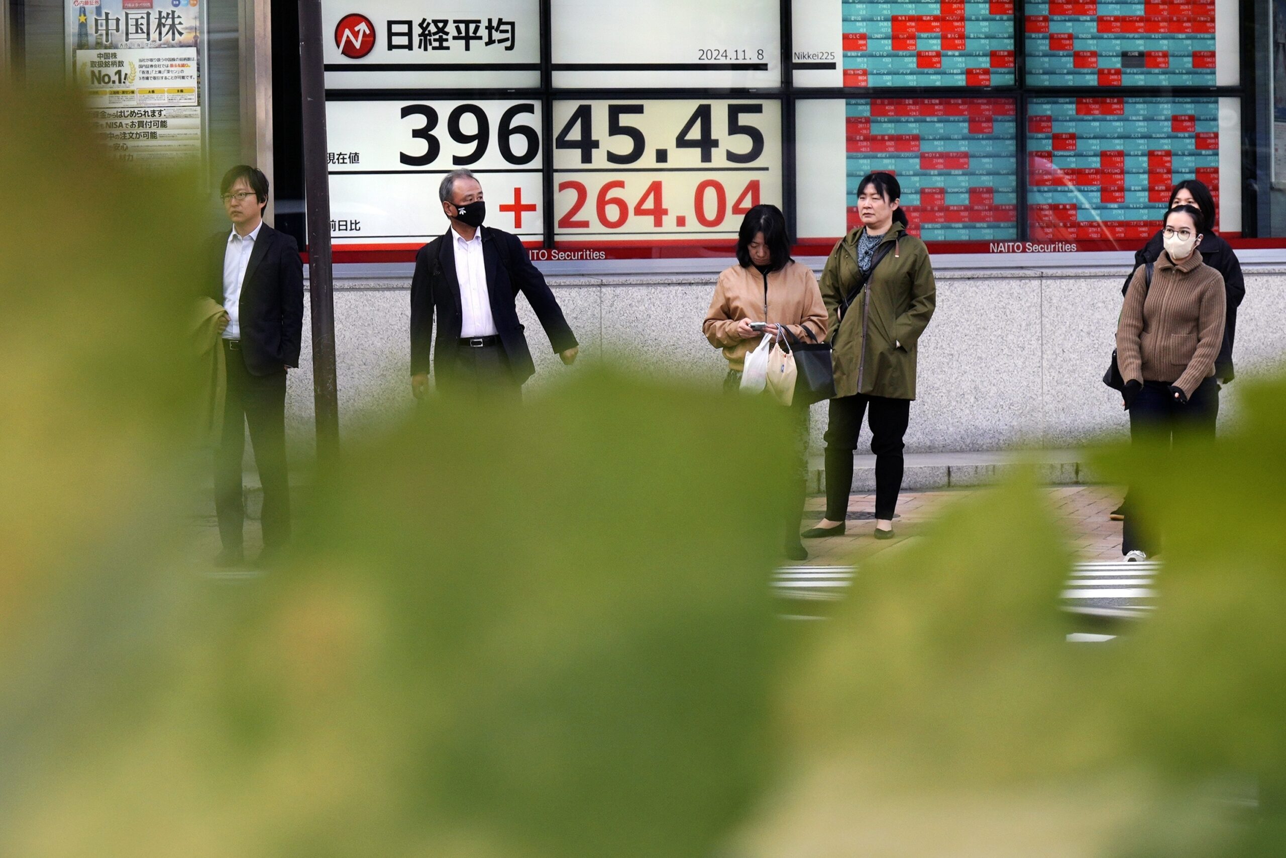 Asian markets extend rally after Fed cut