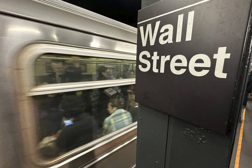 A train arrives at a Wall Street subway station