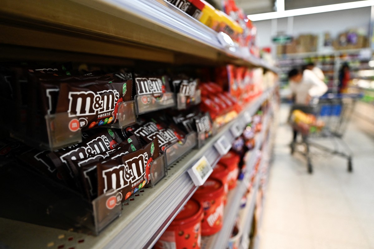 M&M's chocolates are displayed for sale in a Walmart supermarket in Beijing on April 10, 2025. China on April 10, urged the United States to meet it "halfway" as US President Donald Trump imposed more levies on Chinese goods but, in a huge relief to global markets, paused tariffs on other countries. (Photo by Pedro PARDO / AFP)