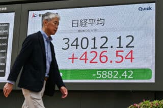 Asian stocks mixed as stability returns, autos lifted by exemption hope