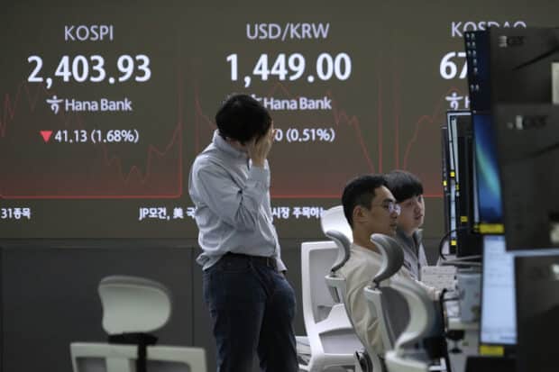 Asian shares sink, with Japan's Nikkei down 5.6 percent as China-US trade war escalates