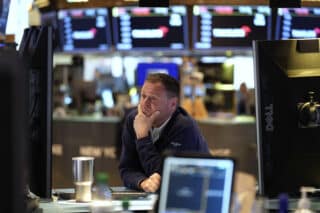 Stocks waver as ECB cuts rate, Trump slams Fed chief