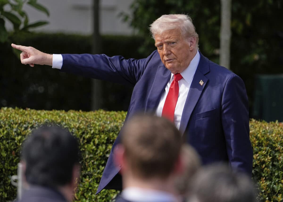 President Donald Trump gestures to the crowd