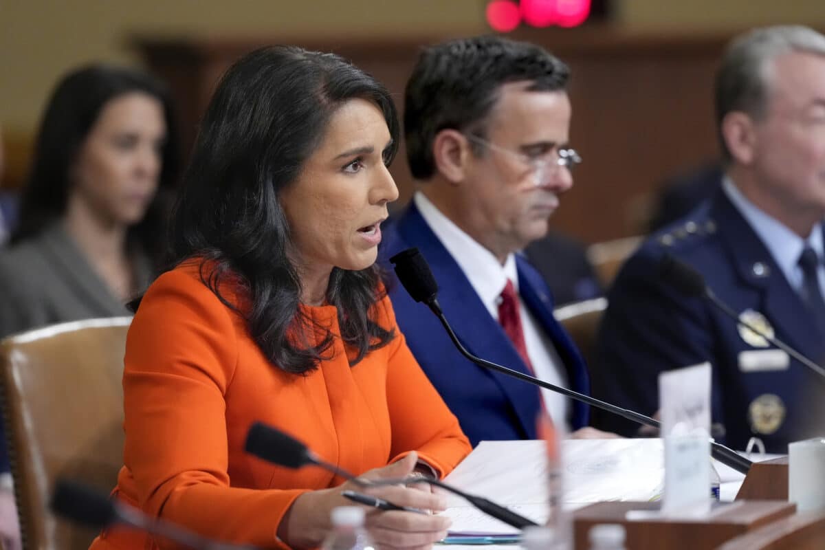 Director of National Intelligence Tulsi Gabbard, left, joined by CIA Director John Ratcliffe, testifies at a House Intelligence Committee hearing on worldwide threats in Washington. (AP Photo/J. Scott Applewhite, File)