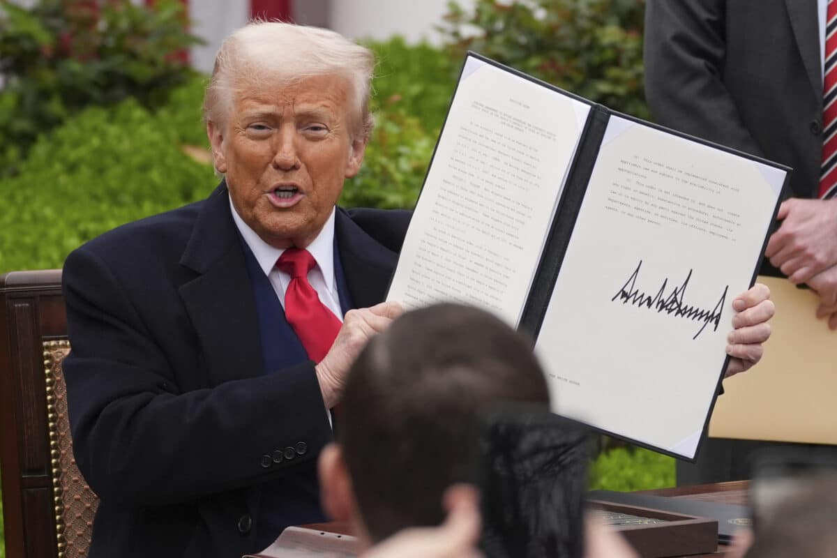 A photo of United States President Donald Trump showing a copy of his executive order on reciprocal tariffs