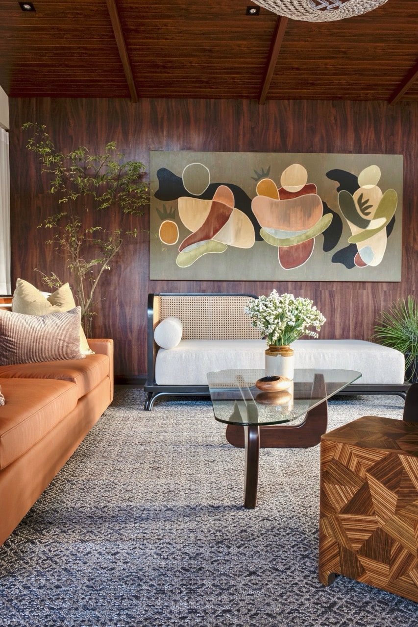 Discover the mid-century charm of Ezra Viniti's interiors, featuring upcycled elegance with doors crafted from recycled tetra packs and mattress fabrics made from ocean-cleanup water bottles. Sustainability meets style in every detail.