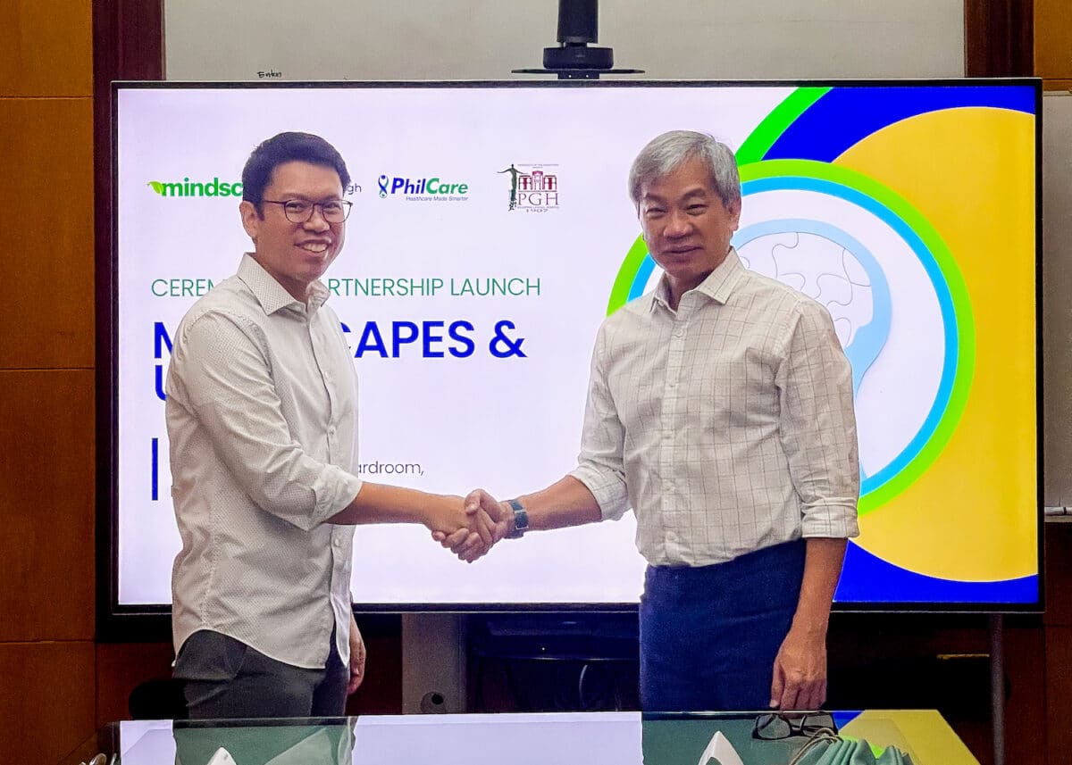 PhilCare president and CEO Jaeger Tanco (left) shakes hands with PGH Director Gerardo Legaspi