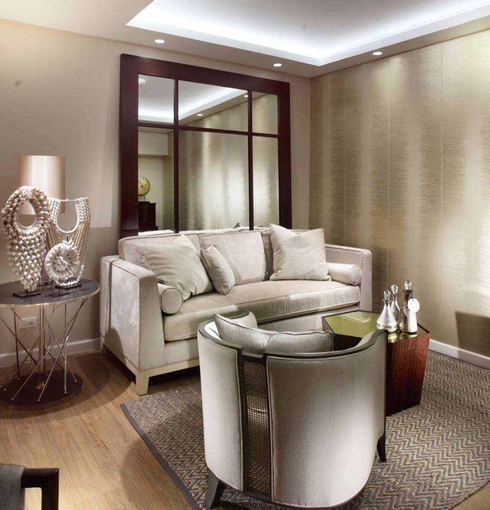 Living room with a big mirror—a neutral monochromatic scheme
