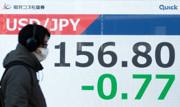 Tokyo stocks strike record high after Japanese premier wins vote