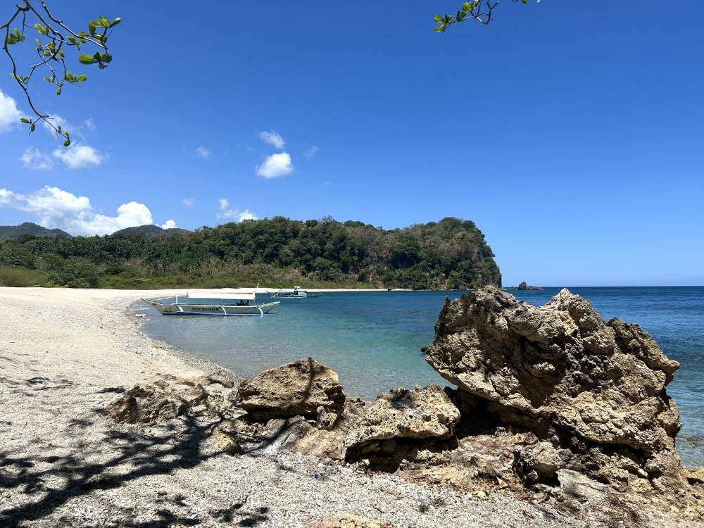 Picturesque rock formations stand along the shoreline of Haligi Beach
