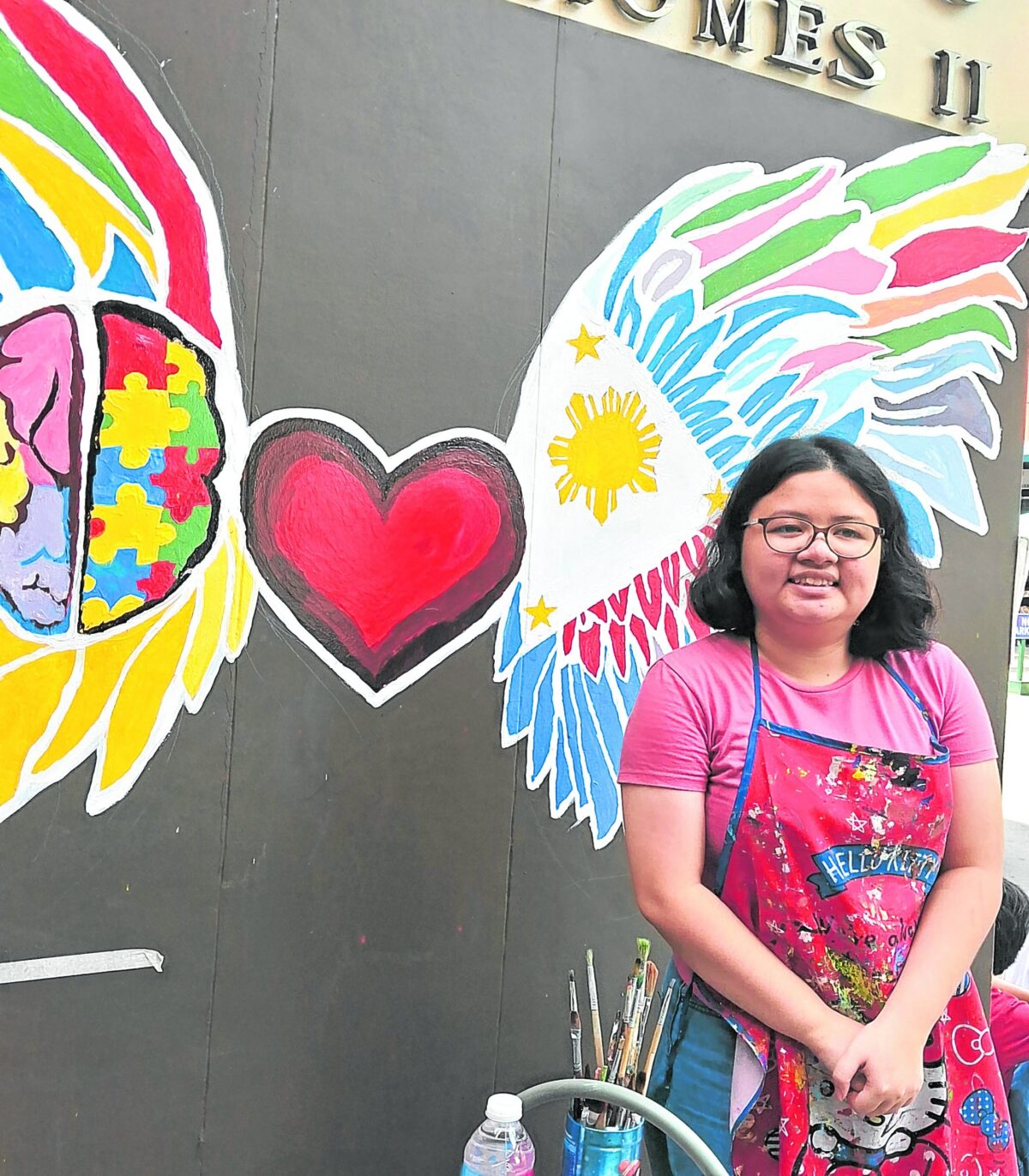 The mural shows the work of an artist who continues to grow, learn, and create despite assumptions about what neurodiverse individuals can and cannot do.