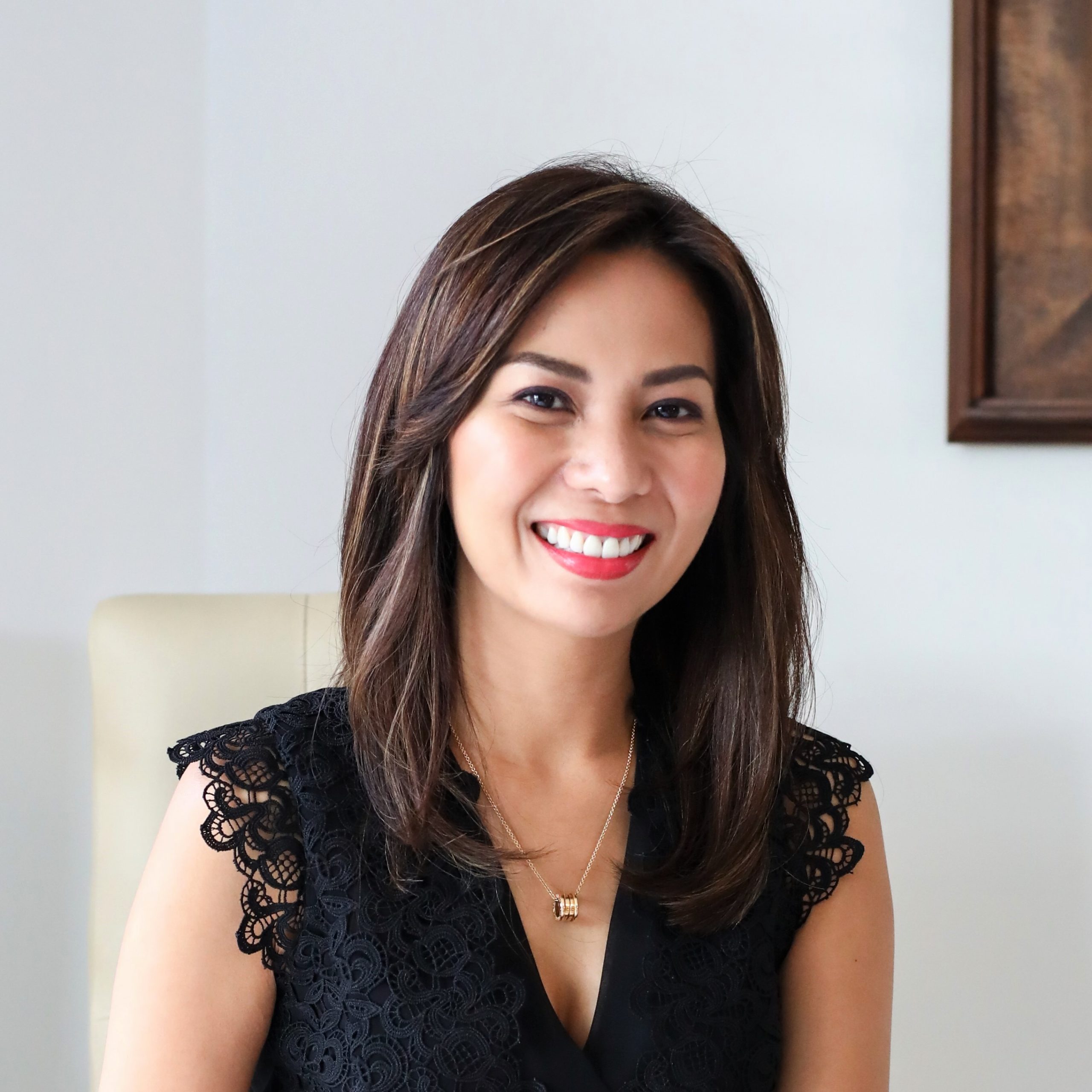 Filipino Woman Smiling Real Estate Investment Expert