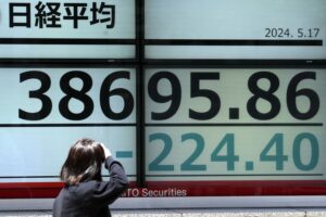 Asian shares mixed as China stocks get bump from new property measures